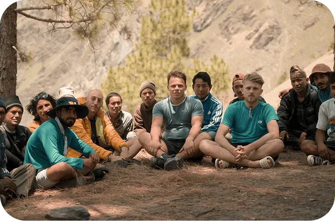 The Real Mad Honey team sitting with honey hunters in Nepal